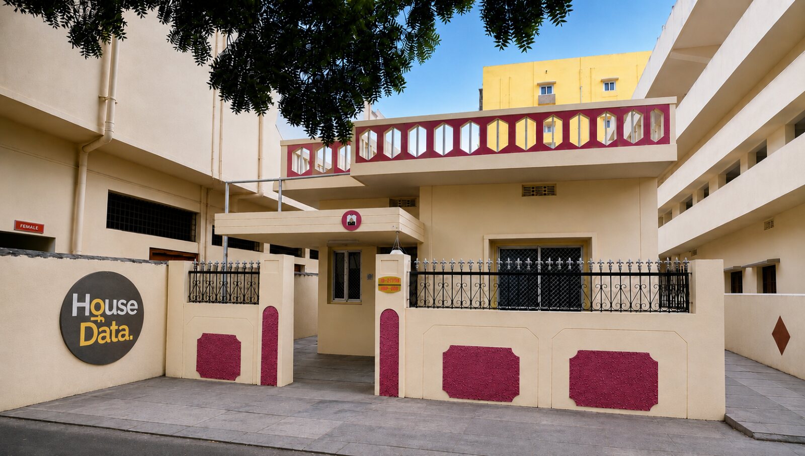 The House of Data building in Kodandaram Nagar, Dilsukhnagar: a cream and maroon house with a black circular House of Data sign on the compound wall.